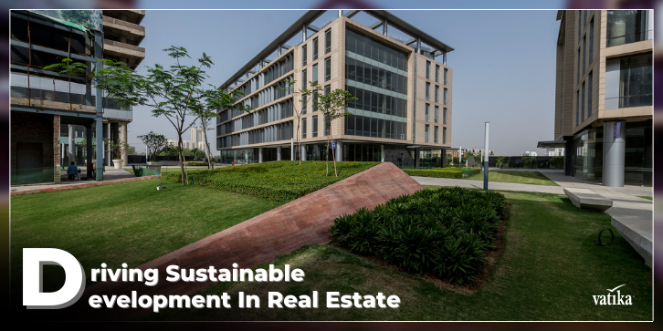 image of vatika city centre in the background with the blog topic "driving sustainable development in real estate" written on it.