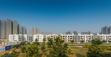 a distant view of duplexes of independent floors project in vatika inxt developed by vatika group