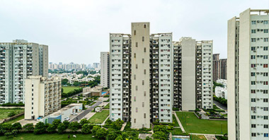 “a view of three towers of seven lamps located in vatika inxt a project by vatika group